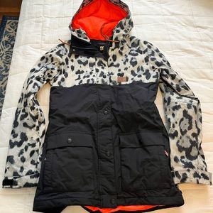 DC womens snowboard jacket. Leopard print with orange lining.